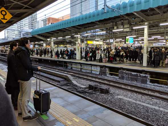 Busy Tokyo station train platform